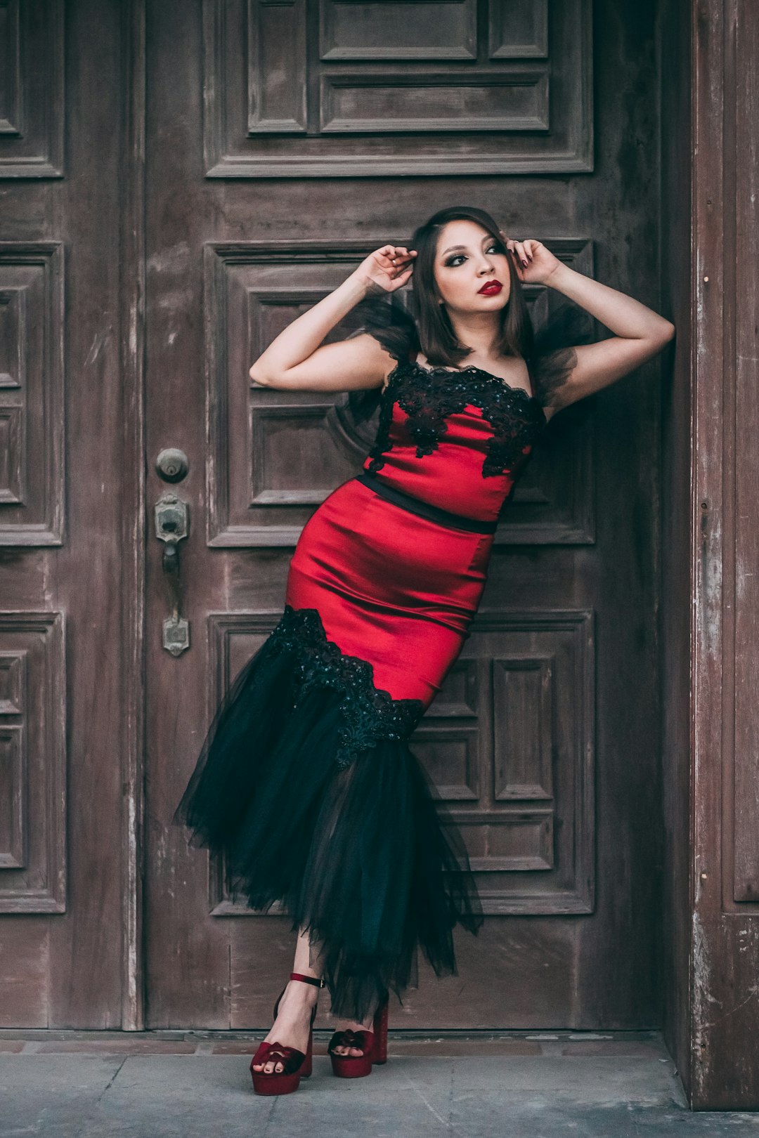 Woman wearing a polished red cocktail dress