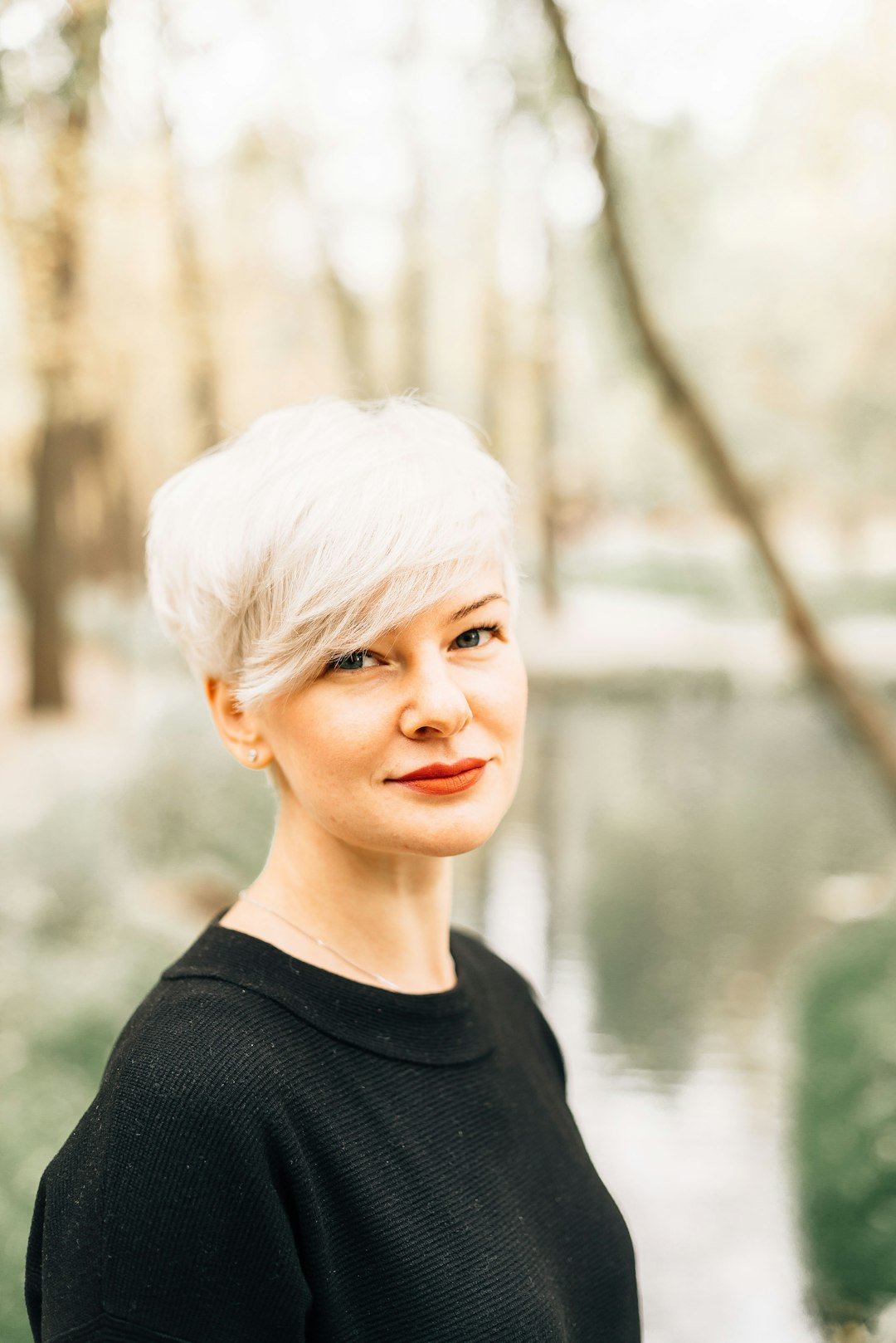 Woman with short hair and a soft wispy fringe