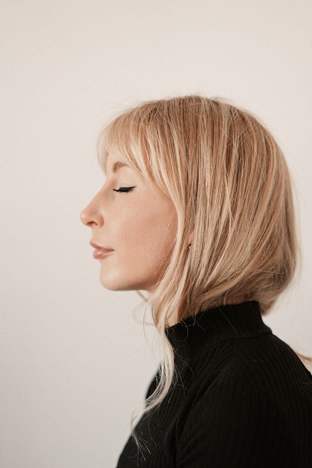 Woman with a polished bob and soft wispy fringe