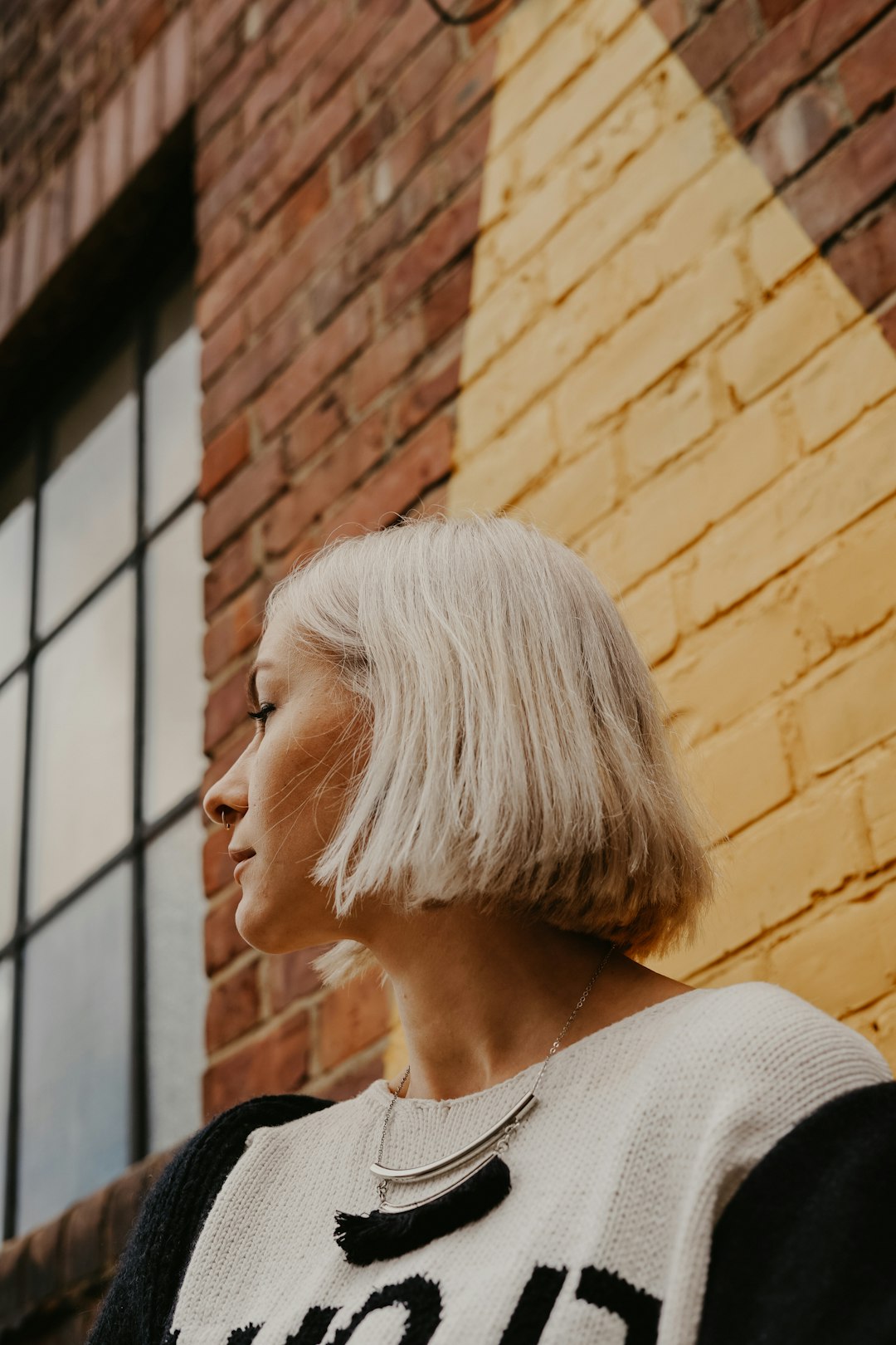 Woman with a long bob and light wispy bangs